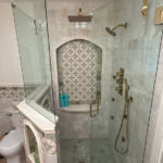 tile shower with glass door.