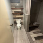 tiled bathroom commode and shower.