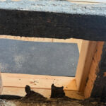 Close-up detail of the framing at the tub-and-shower area.