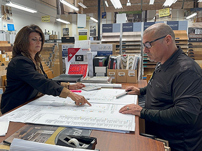 Jacqueline reviews plans with Felipe in the Ventura showroom.